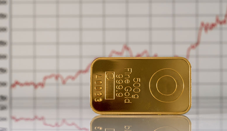 gold bar with stock graph