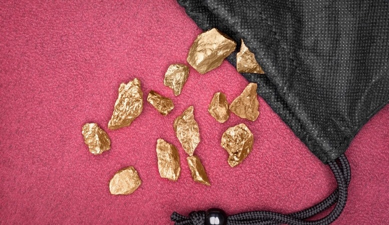 gold nuggets out from a pouch