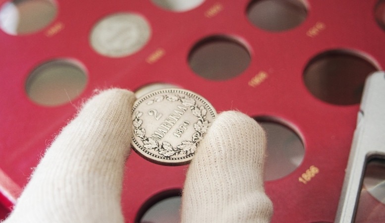 inspecting a bullion coin featured image