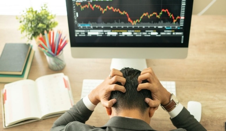 business man struggling because of stock chart