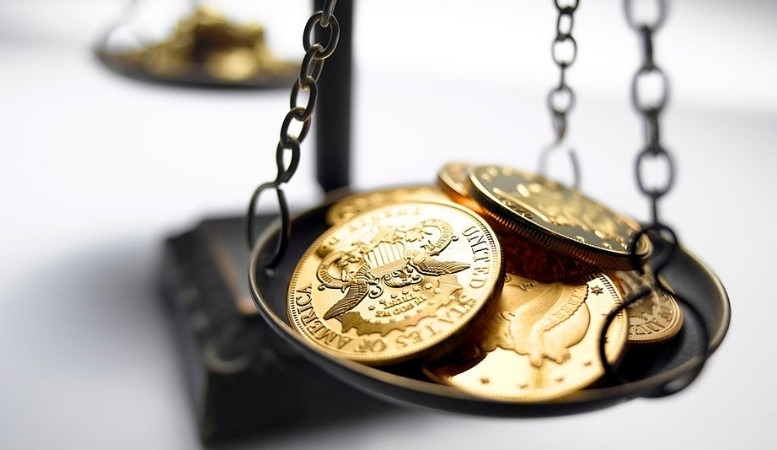 gold coins in a weighing scale