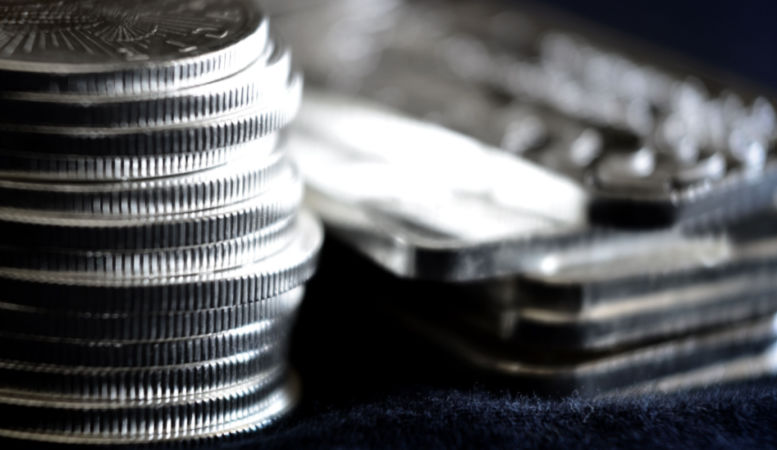 silver coins and bars close up photo
