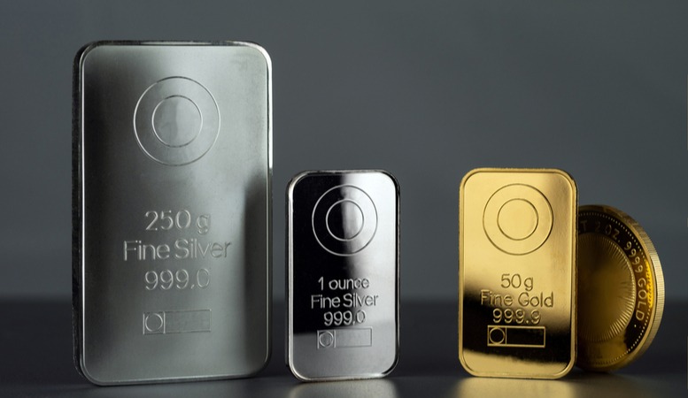 gold and silver bars in a gray background
