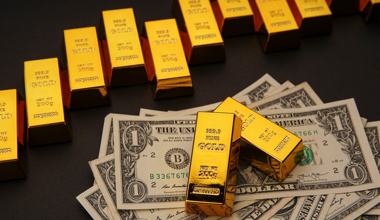 gold bars and us dollars
