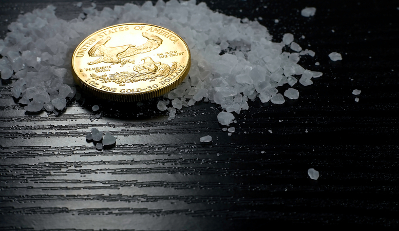 one oz gold coin surrounded by salts