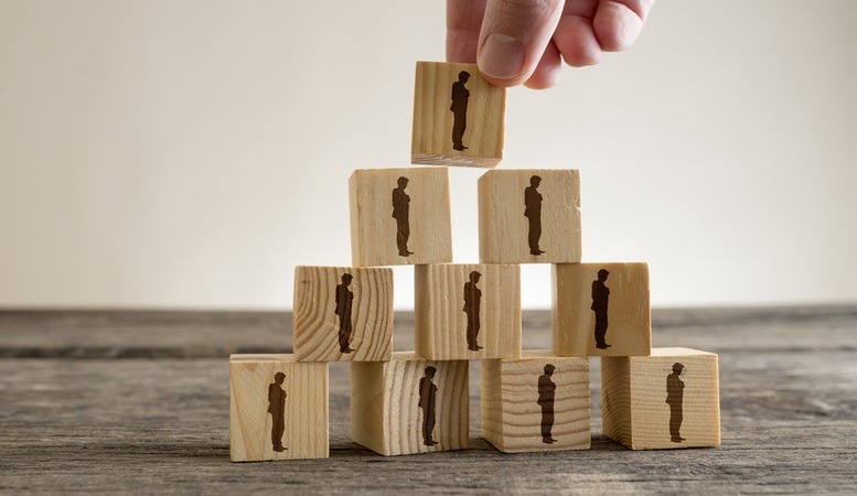 blocks with man drawn to it and stacked like a pyramid featured image