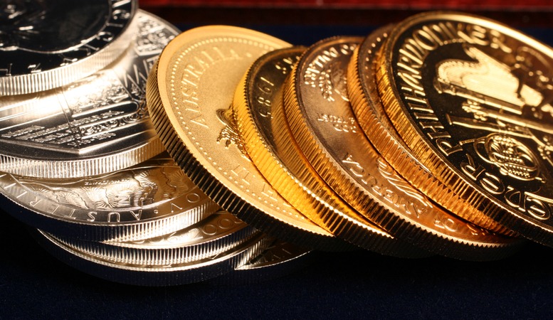 gold and silver coins stacked