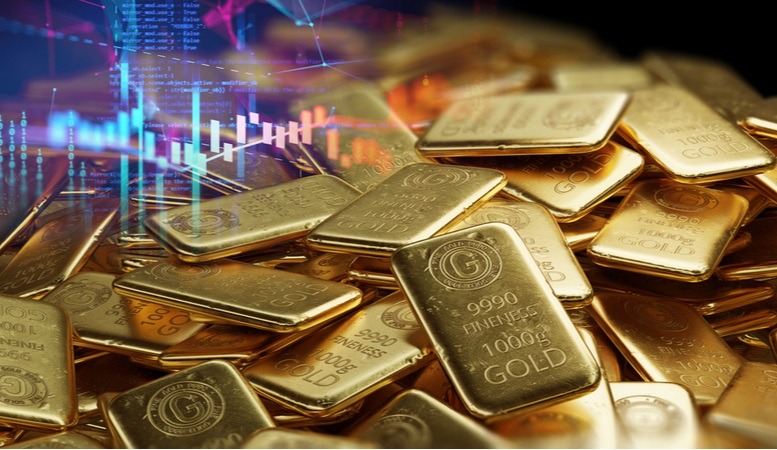 gold stock chart beside gold bars