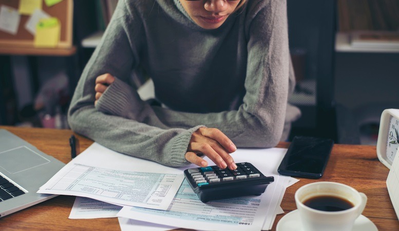 woman computing her taxes on an ira
