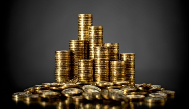 stack of gold coins on a grey background featured image