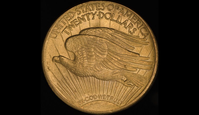 1933 double eagle gold coin on black background