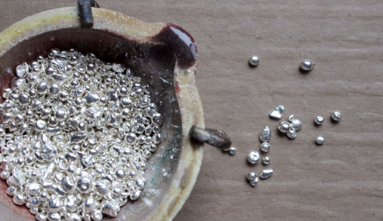 melting pot with grains of silver for making jewelry