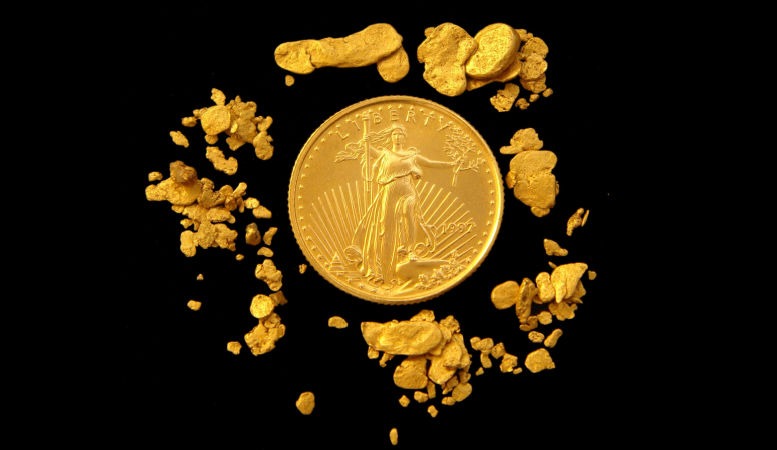 us gold eagle coin surrounded by gold nuggets featured image