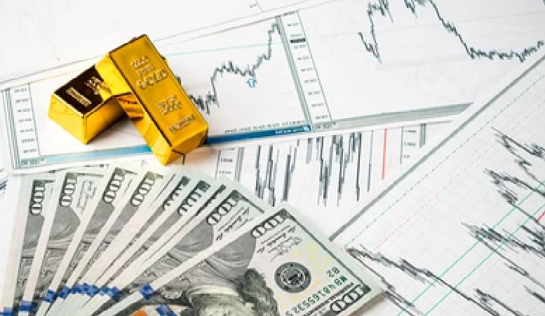 gold bars and dollar bills on chart background