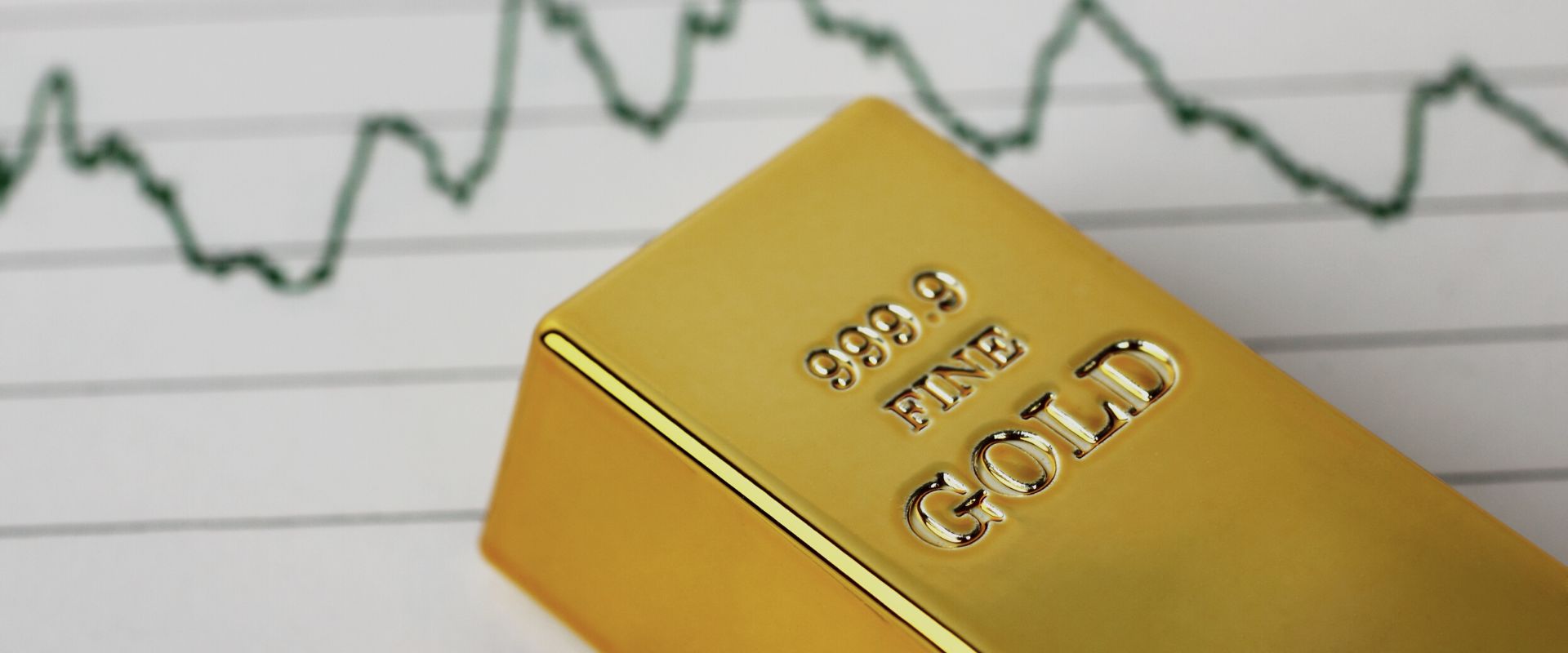 gold bar with a gold chart in the background
