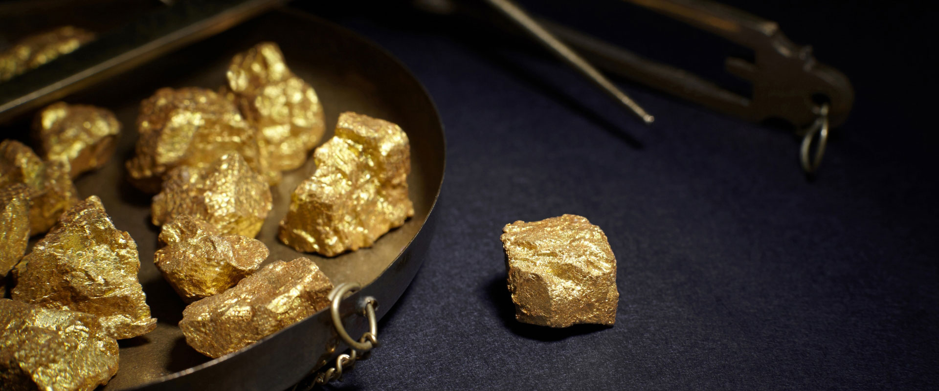 pile of gold nuggets in mining company
