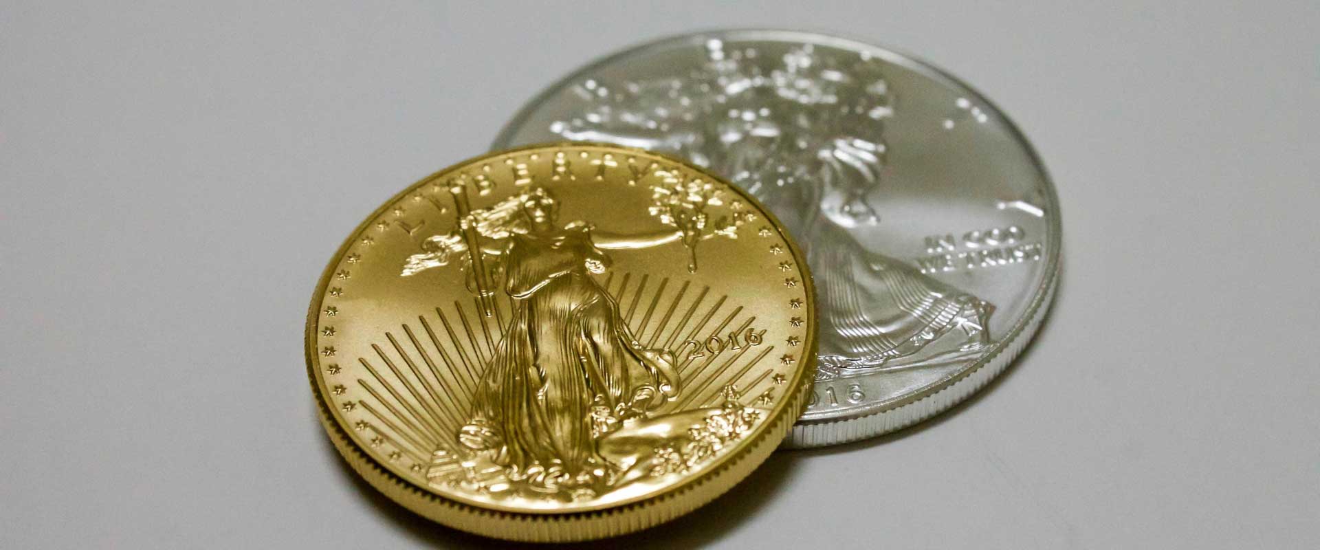 gold coin and silver coin