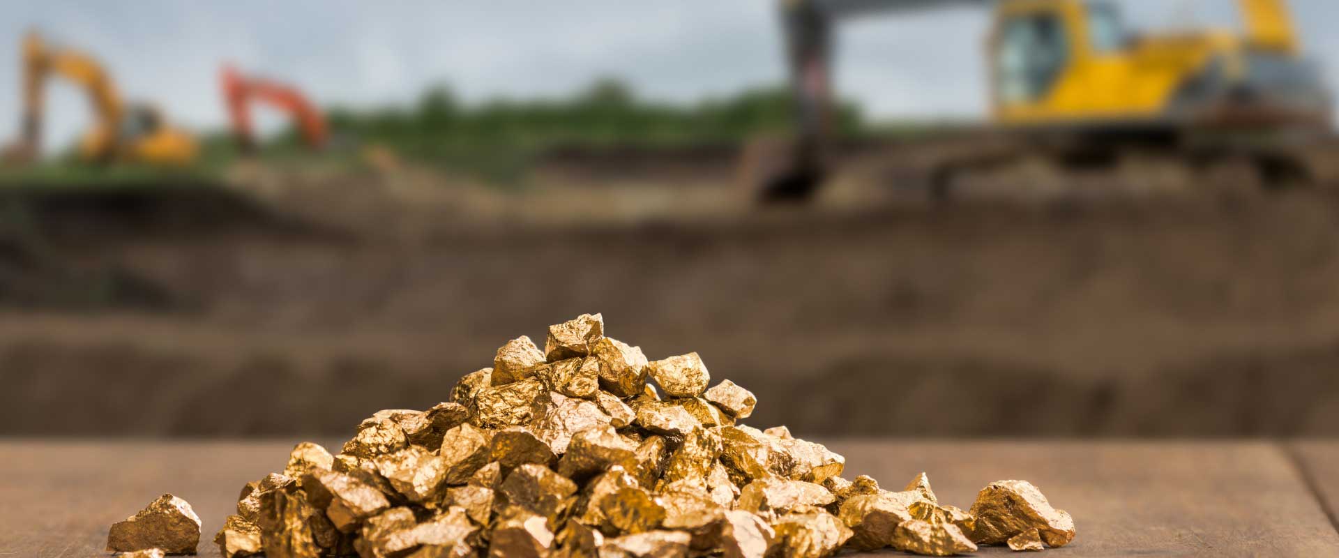 gold nuggets on gold mining site background