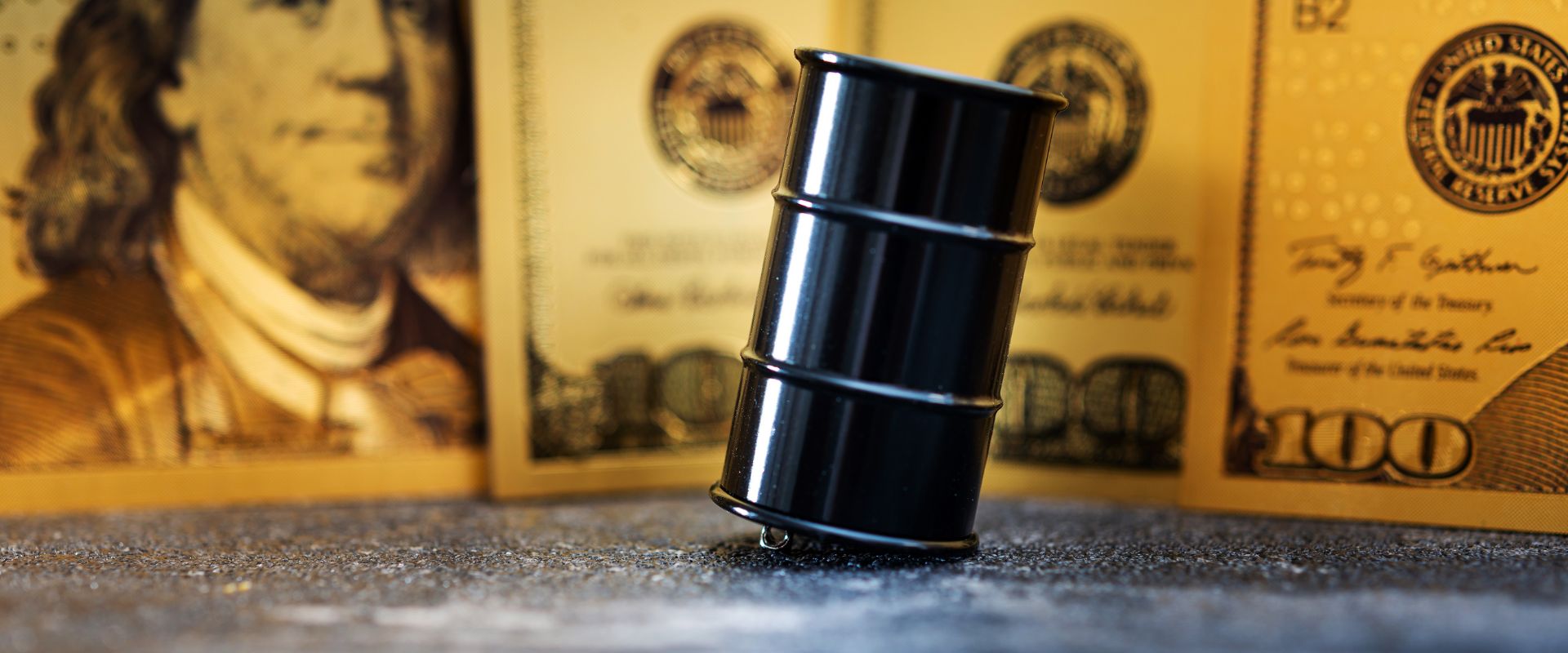 oil barrel with the dollar behind of it