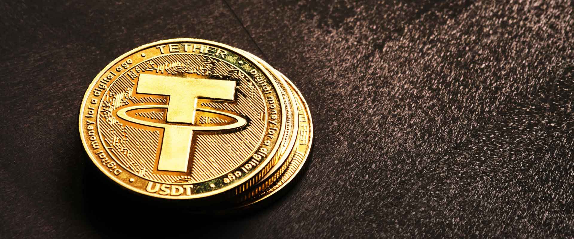stack of gold coins with logo of tether gold