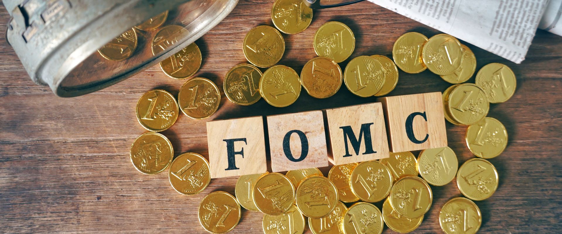 fomc text on blocks surrounded by gold coins