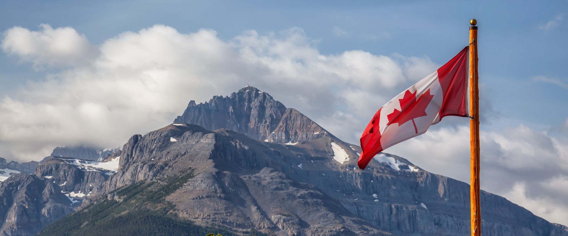 canadian flag in the mountains