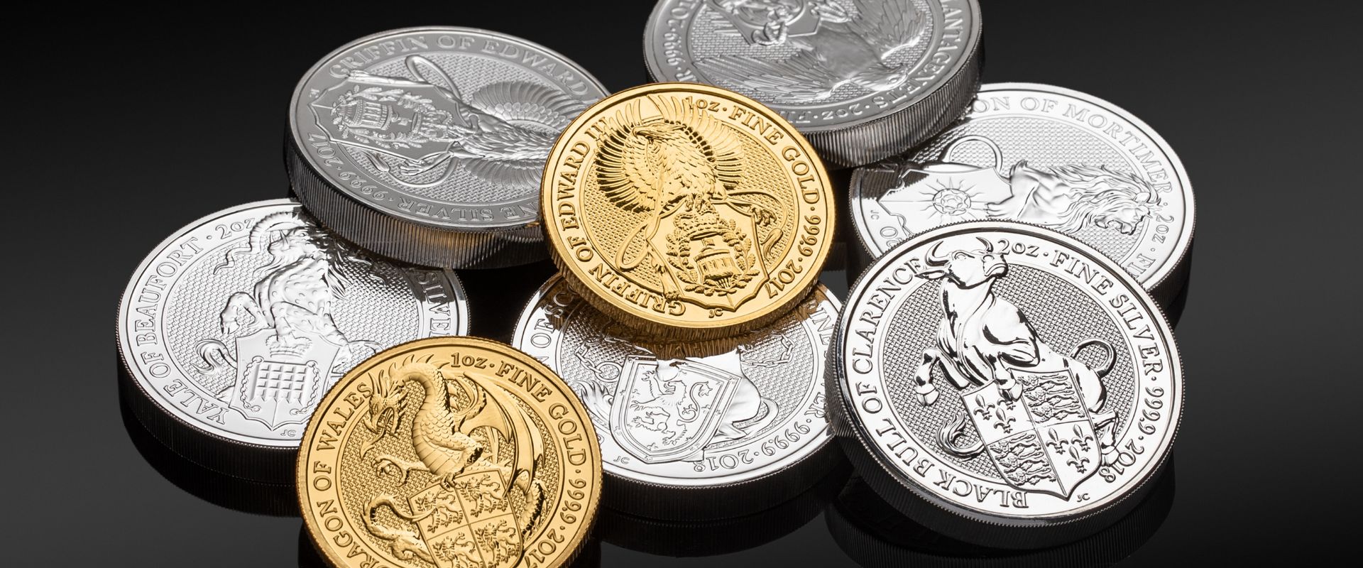 silver and gold coins with a black background