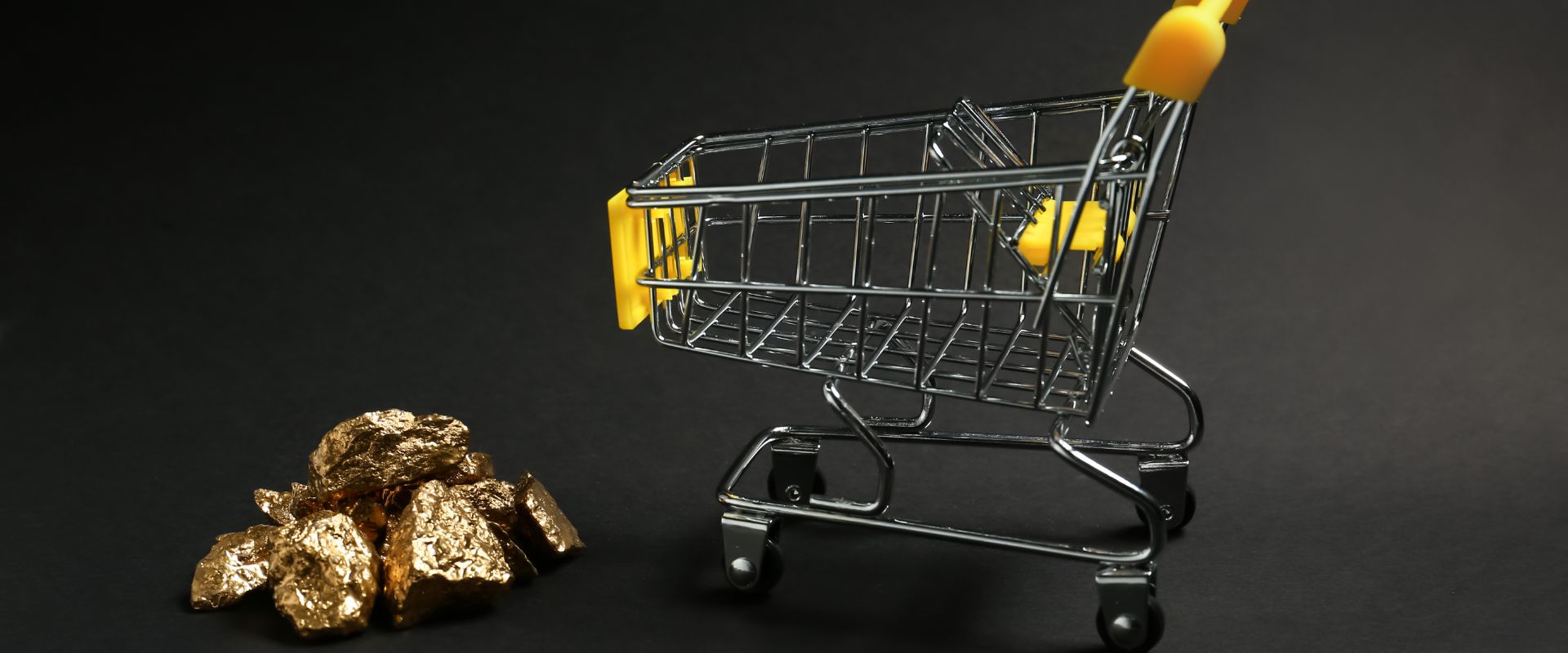 pile of gold nugget and shopping cart