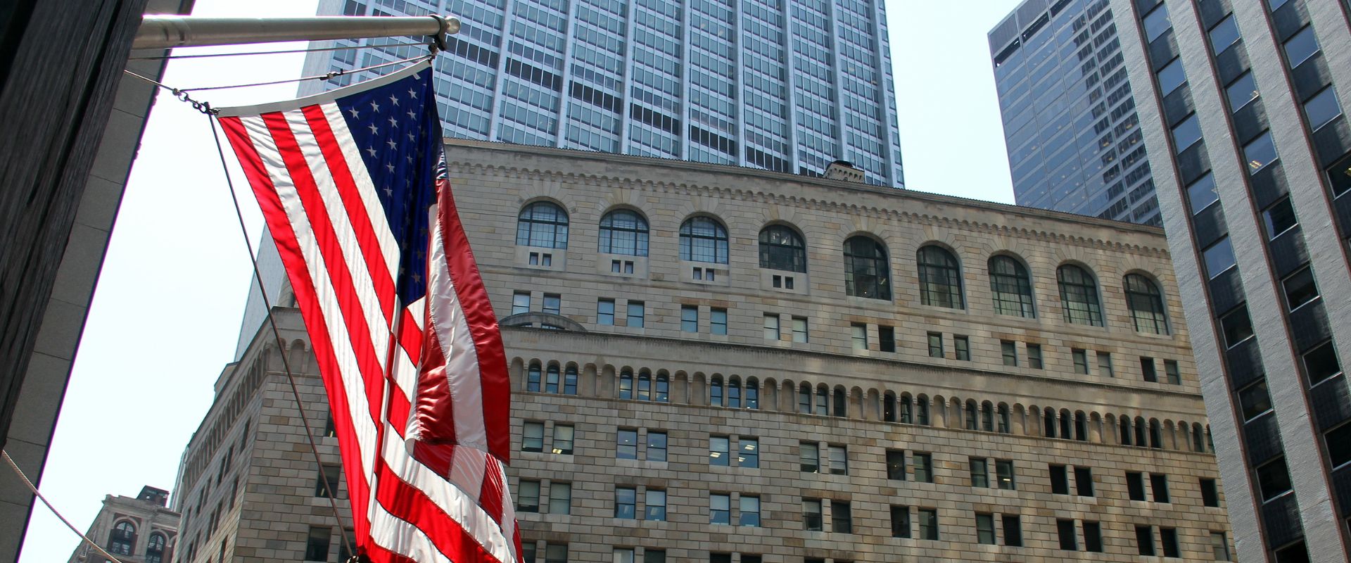 us flag and a federal reserve building in new york