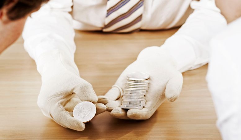 coin collector selling his silver coins to investor