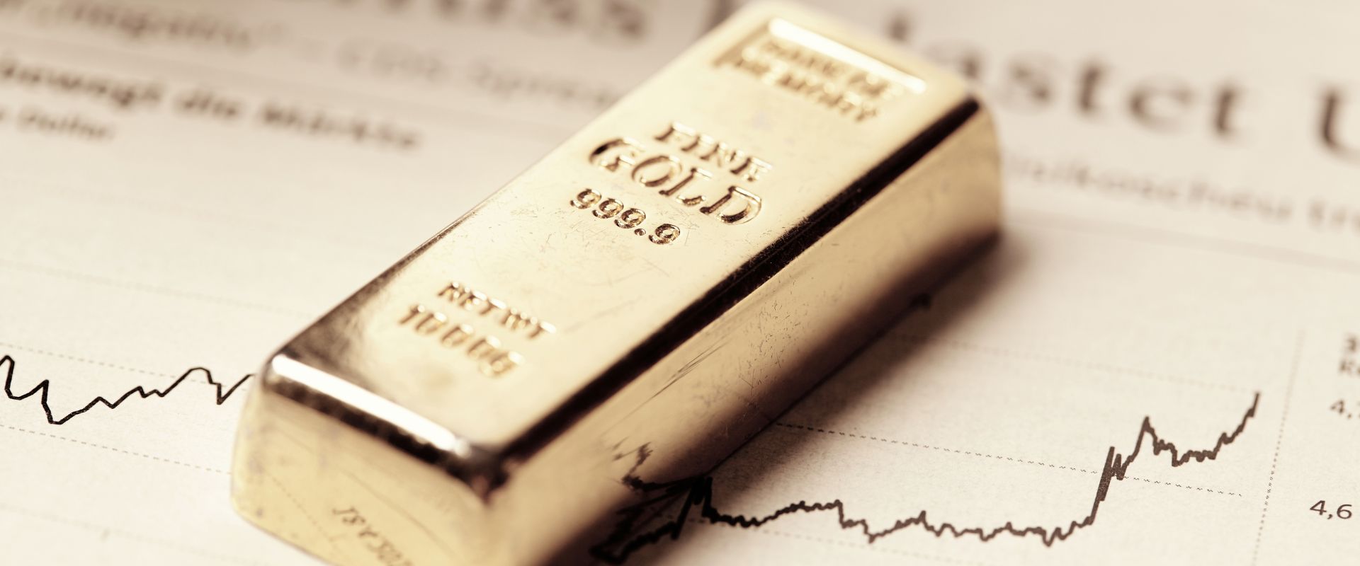 one kilogram of gold bar on rising price chart
