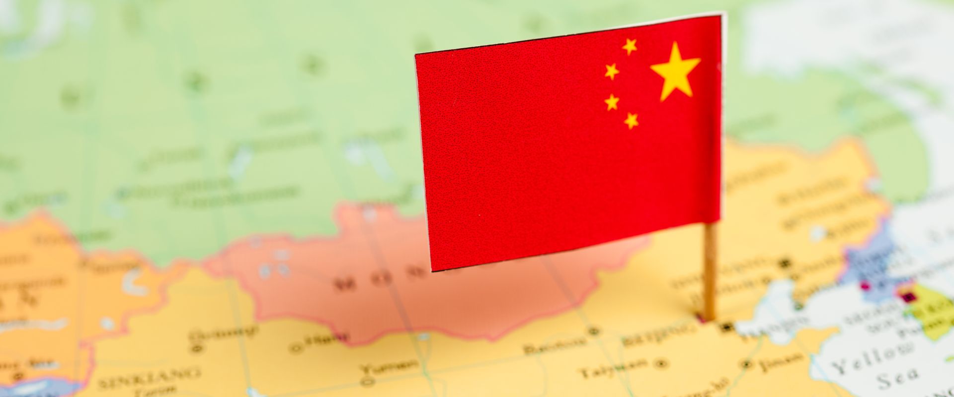 china flag pinned on world map