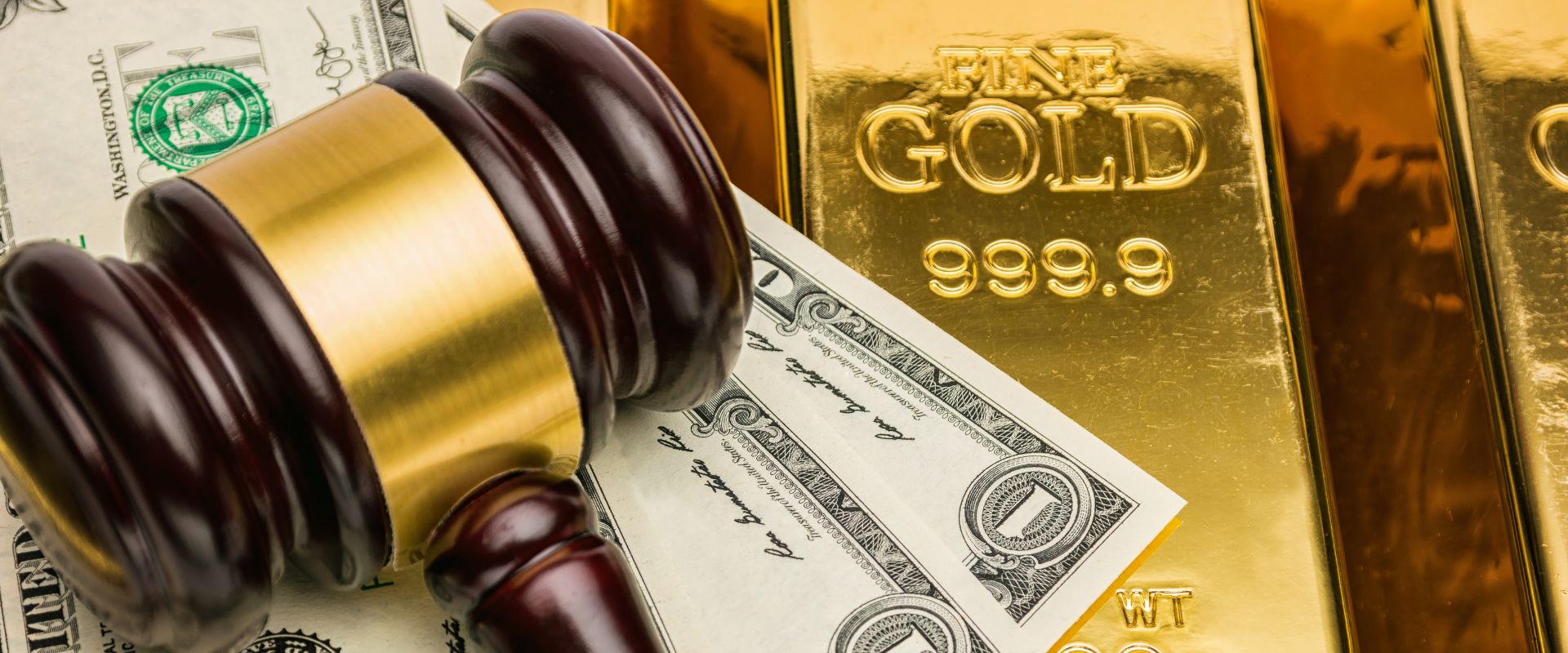 gold bars with us dollar and judge gavel